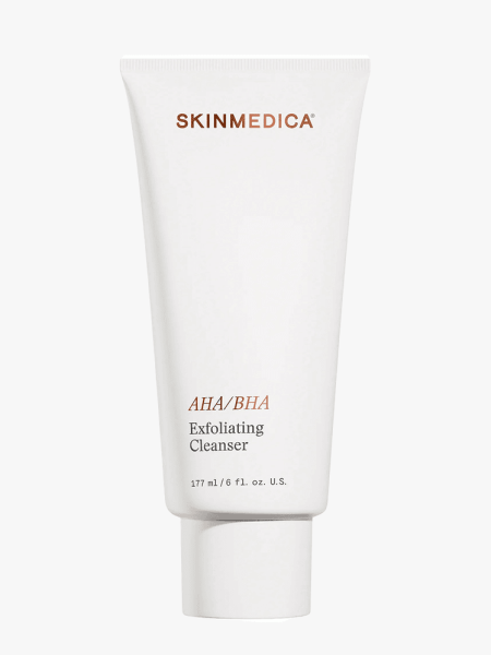 A white tube of SkinMedica AHA/BHA Exfoliating Cleanser on a light gray background